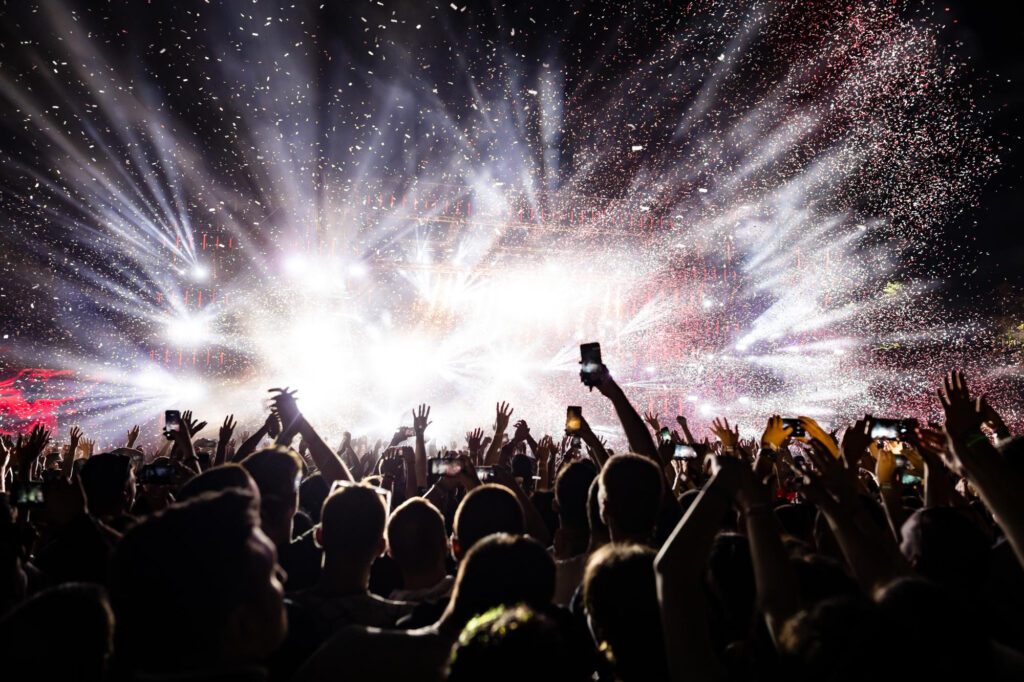 excited audience watching confetti fireworks having fun music festival night copy space
